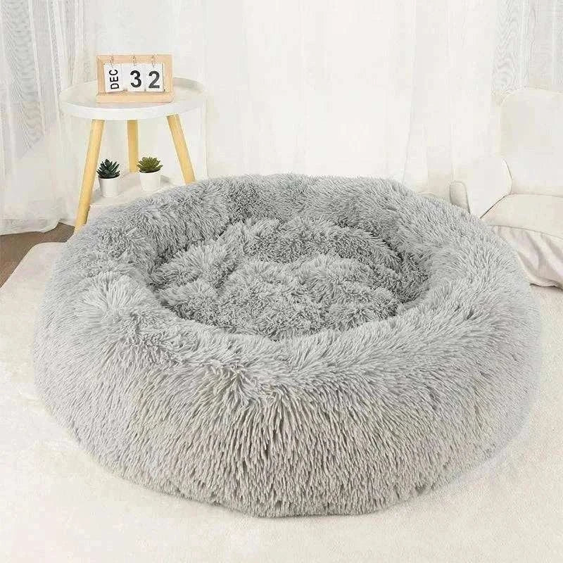 Plush grey calming bed for pets, available in various sizes for optimal comfort and relaxation.