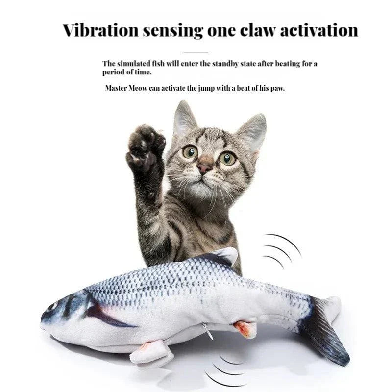 Cat playing with a vibration-activated Dancing Stuffed Fish toy.