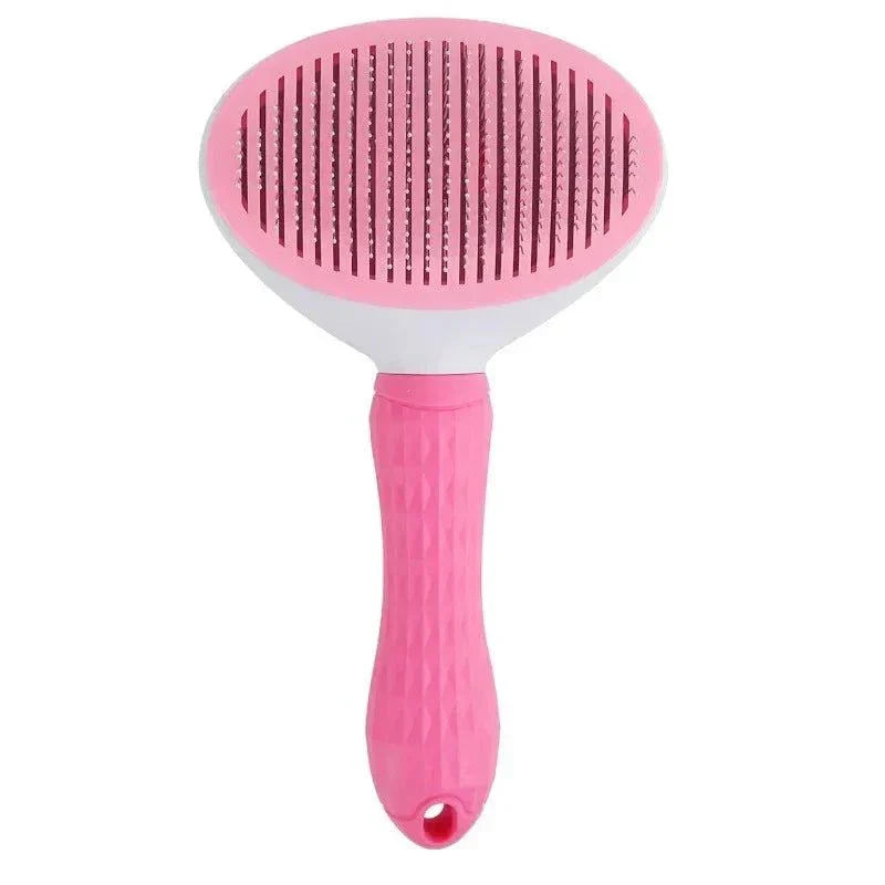 Pink ergonomic pet hair brush with soft bristles for grooming dogs and cats.