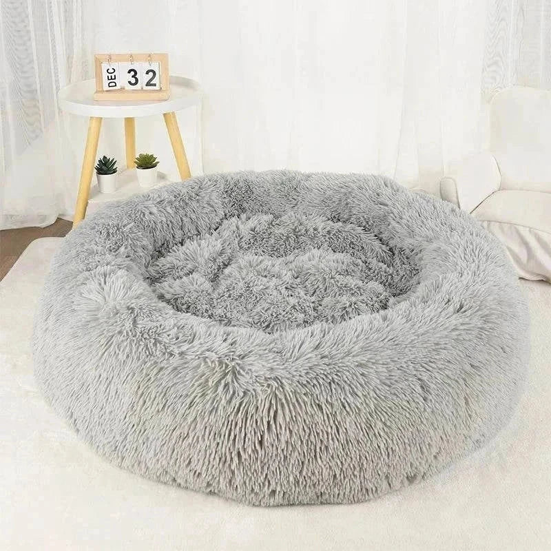 Plush grey calming bed for pets, available in various sizes for optimal comfort and relaxation.