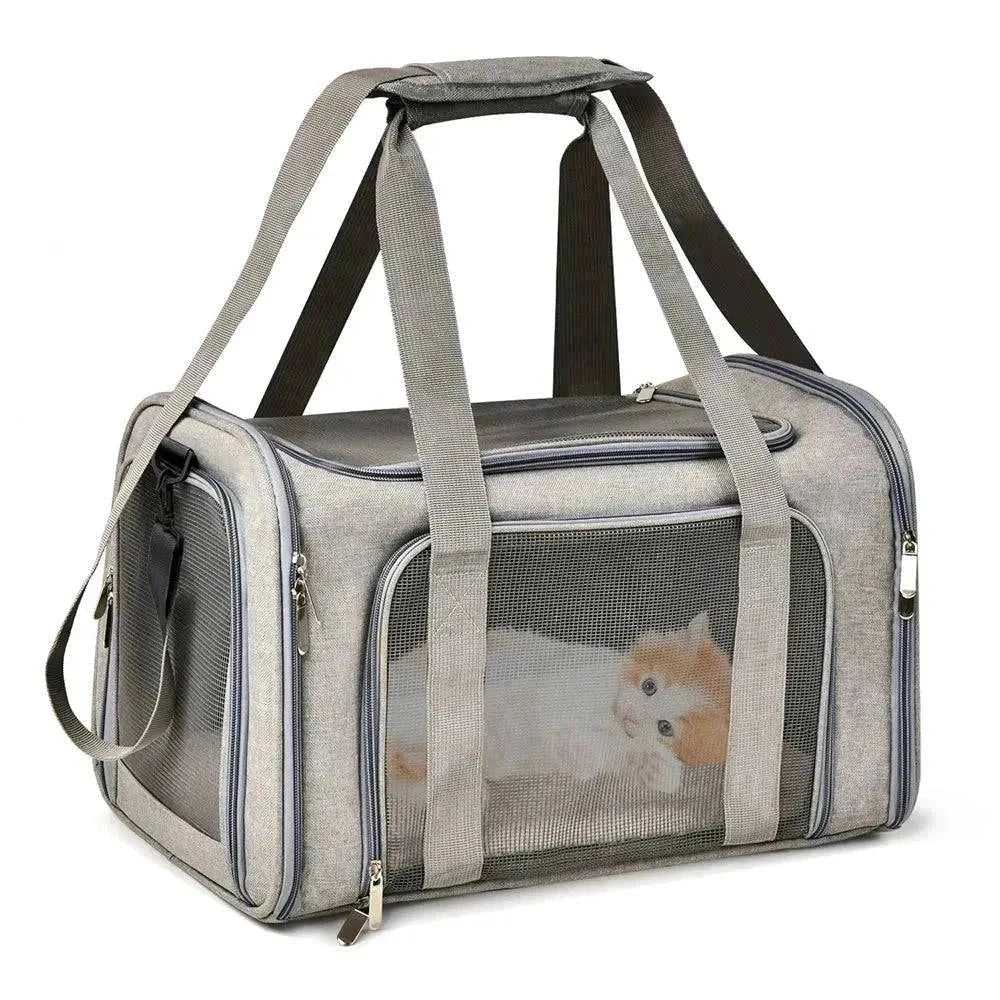 Soft-sided pet carrier with mesh panels and adjustable shoulder strap.