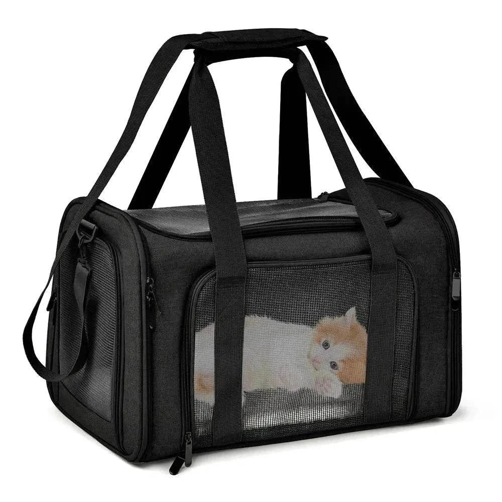 Premium Soft-Sided Pet Carrier with mesh panels, adjustable shoulder strap, and removable fleece bed.