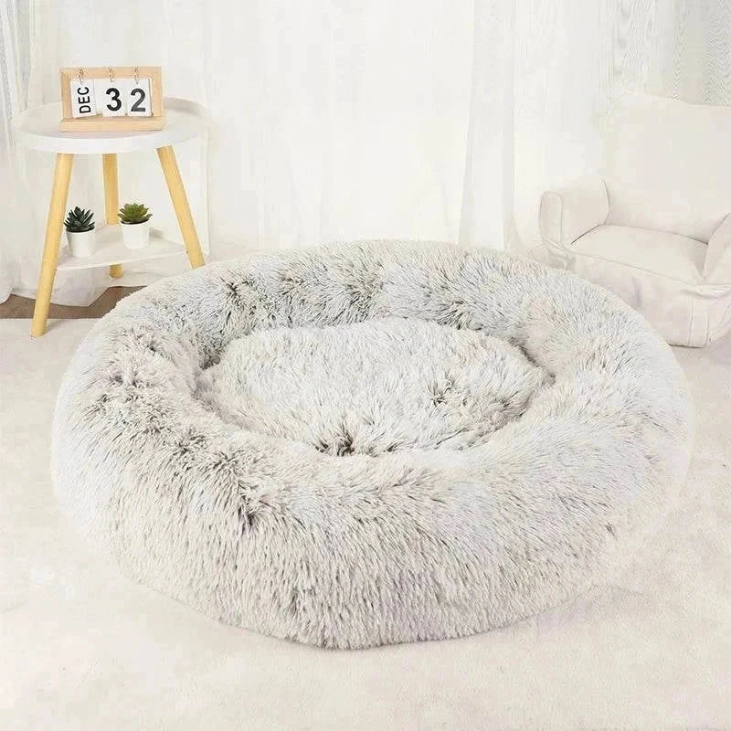 Plush Calming Bed for pets in a cozy room setting.