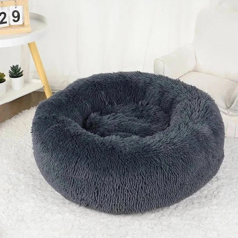 Plush gray calming pet bed with soft fabric and non-slip base for relaxation.